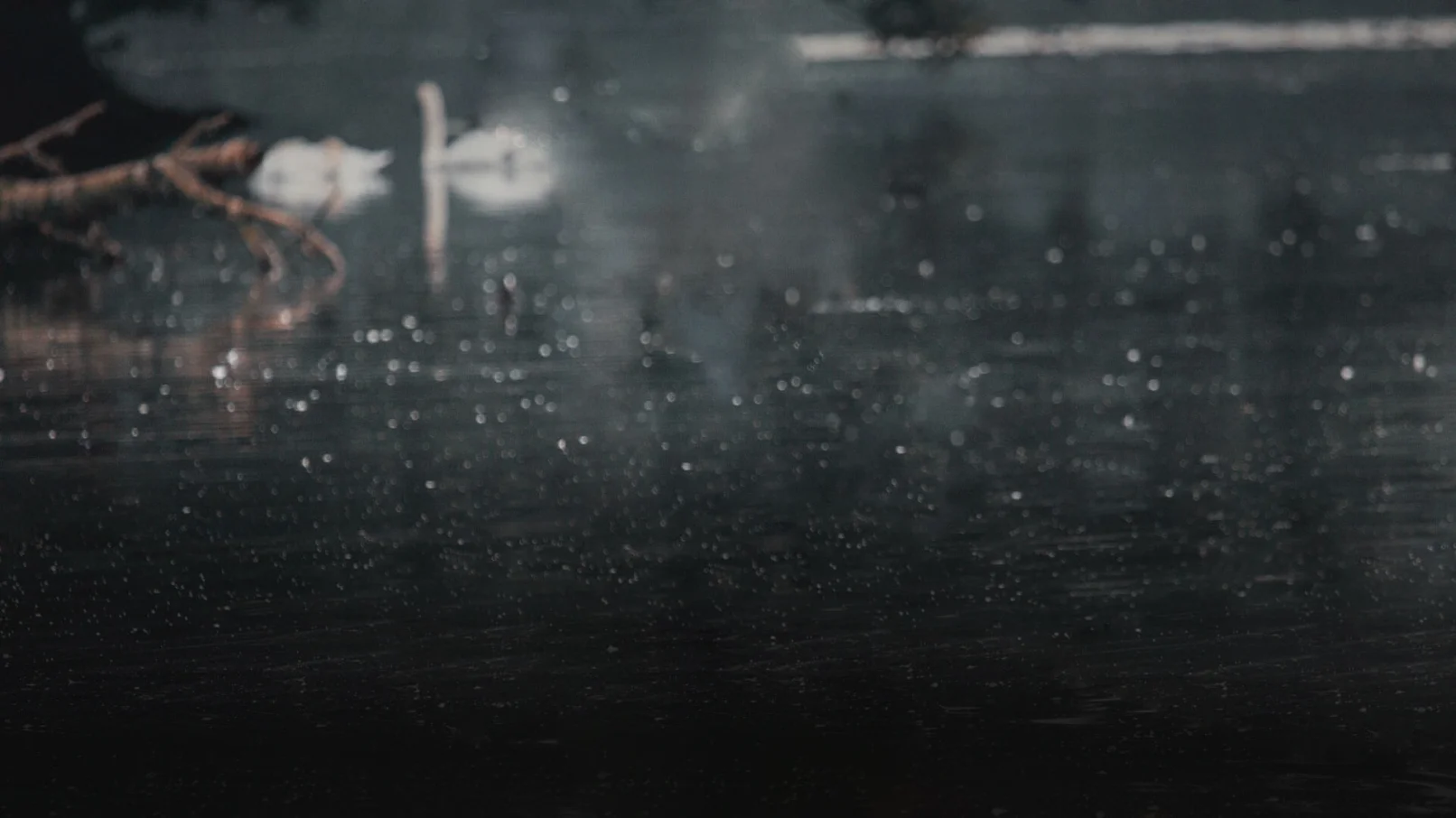A blurry image of the rain on a window.